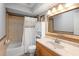 Bathroom with a shower/tub combo, a large mirror, and a single sink vanity at 219 Brevity Ln, Deland, FL 32724