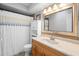 Bathroom with a shower/tub combo, a large mirror, and a single sink vanity at 219 Brevity Ln, Deland, FL 32724
