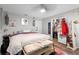 Bright bedroom featuring wood floors, closet, and decorative artwork at 219 Brevity Ln, Deland, FL 32724
