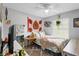 Bright bedroom features a ceiling fan, a side table and a work space at 219 Brevity Ln, Deland, FL 32724