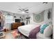 Bedroom with wood floors, a dresser and flat screen TV at 219 Brevity Ln, Deland, FL 32724