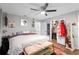 Bright bedroom featuring wood floors, closet, and decorative artwork at 219 Brevity Ln, Deland, FL 32724