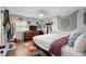 Bedroom with wood floors, a dresser and flat screen TV at 219 Brevity Ln, Deland, FL 32724