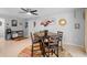 Bright dining area with stylish table set, tile floors, and modern decor at 219 Brevity Ln, Deland, FL 32724