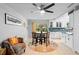 Cozy dining area with tile floors, modern lighting, and a view to the outside at 219 Brevity Ln, Deland, FL 32724