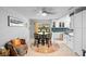 Cozy dining area with tile floors, modern lighting, and a view to the outside at 219 Brevity Ln, Deland, FL 32724