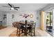 Bright dining area with stylish table set, tile floors, and modern decor at 219 Brevity Ln, Deland, FL 32724