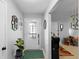 Bright foyer with a decorative glass door, tiled floors, and a plant on a stand at 219 Brevity Ln, Deland, FL 32724