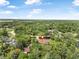 Expansive aerial view of a home nestled among lush greenery and mature trees, indicating privacy at 229 Riverbend Rd, Ormond Beach, FL 32174