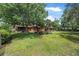 Fenced backyard with a well-maintained lawn and landscaping at 229 Riverbend Rd, Ormond Beach, FL 32174