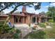 Backyard with a patio and seating area surrounded by landscaping at 229 Riverbend Rd, Ormond Beach, FL 32174