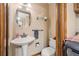 Cozy bathroom featuring a pedestal sink, and wall-mounted shelving at 229 Riverbend Rd, Ormond Beach, FL 32174