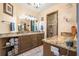 Luxurious bathroom with double vanity, granite countertops, and a tiled shower at 229 Riverbend Rd, Ormond Beach, FL 32174