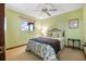 Cozy bedroom boasts a ceiling fan and natural light, creating a peaceful and inviting atmosphere at 229 Riverbend Rd, Ormond Beach, FL 32174