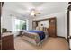Charming bedroom features bright natural light, a ceiling fan, and custom built-in cabinets and drawers at 229 Riverbend Rd, Ormond Beach, FL 32174
