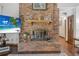 Close-up of a brick fireplace with a decorative mantle and hearth, perfect for cozy evenings and adding warmth to the home at 229 Riverbend Rd, Ormond Beach, FL 32174
