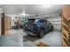 Spacious garage featuring epoxy floors, storage, and room for parking at 229 Riverbend Rd, Ormond Beach, FL 32174