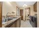 Laundry room features granite counters, stainless steel sink, and modern washer and dryer at 229 Riverbend Rd, Ormond Beach, FL 32174