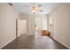Bedroom featuring wood floors with closet, doorways and dresser at 2395 Old Reynolds Rd, De Leon Springs, FL 32130