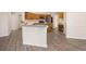 Functional kitchen with an island, oak cabinetry, stainless appliances, and eat-in dining at 2395 Old Reynolds Rd, De Leon Springs, FL 32130