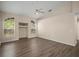 Bright living room featuring vaulted ceilings, wood flooring, and light-filled windows at 2395 Old Reynolds Rd, De Leon Springs, FL 32130