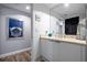 Contemporary bathroom featuring modern fixtures and wood-look flooring at 241 Riverside Dr # 1909, Daytona Beach, FL 32117