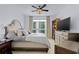 Bright bedroom featuring a ceiling fan, ample natural light, and views of the city at 241 Riverside Dr # 1909, Daytona Beach, FL 32117