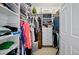 Well-organized walk-in closet with ample storage space and shelving at 241 Riverside Dr # 1909, Daytona Beach, FL 32117