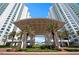 Stunning entryway with palms leading up to an awning covered drop-off point at Marina Grande at 241 Riverside Dr # 1909, Daytona Beach, FL 32117
