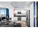 Modern kitchen featuring white cabinetry, stainless steel appliances, and dark countertops at 241 Riverside Dr # 1909, Daytona Beach, FL 32117