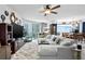 Inviting living room with comfortable seating, a large TV, and natural light at 241 Riverside Dr # 1909, Daytona Beach, FL 32117