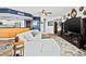 Open-concept living area featuring a stylish kitchen and a large, comfortable sofa at 241 Riverside Dr # 1909, Daytona Beach, FL 32117
