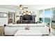 Bright living room with stylish decor and an expansive water view from the balcony at 241 Riverside Dr # 1909, Daytona Beach, FL 32117