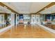 Spacious studio with hardwood floors, mirrors, and exercise equipment for fitness and wellness activities at 241 Riverside Dr # 1909, Daytona Beach, FL 32117
