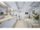 Bright bathroom featuring double sinks, a luxurious bathtub, and modern finishes at 241 Riverside Dr # 304, Daytona Beach, FL 32117
