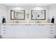Elegant bathroom featuring a double vanity with framed mirrors and plenty of storage space at 241 Riverside Dr # 304, Daytona Beach, FL 32117