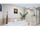 Modern bathroom with glass shower, soaking tub, and neutral decor, designed for relaxation at 241 Riverside Dr # 304, Daytona Beach, FL 32117