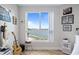 Bedroom featuring a waterfront view from large window, complete with guitars and sports memorabilia at 241 Riverside Dr # 304, Daytona Beach, FL 32117