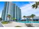 View of condo from exterior showing pool and surrounding community space at 241 Riverside Dr # 304, Daytona Beach, FL 32117