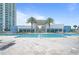 View of condo community pool and outdoor clubhouse area at 241 Riverside Dr # 304, Daytona Beach, FL 32117