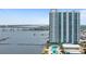 High-rise condo building featuring a pool, waterfront views, and nearby bridges at 241 Riverside Dr # 304, Daytona Beach, FL 32117