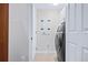 Efficient laundry room featuring a modern washer and dryer and bright lighting at 241 Riverside Dr # 304, Daytona Beach, FL 32117