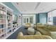 Inviting library with comfortable seating, bookcases and a large TV screen at 241 Riverside Dr # 304, Daytona Beach, FL 32117