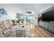 Inviting living room showcasing wood floors, comfortable furnishings, and large windows with scenic views at 241 Riverside Dr # 304, Daytona Beach, FL 32117