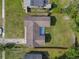 Aerial view showcasing the home, driveway, and fenced backyard, offering a glimpse of the property's layout at 243 S Hull Ave, Deland, FL 32720