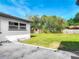 The spacious backyard includes a shed, well-maintained lawn, and new privacy fence at 243 S Hull Ave, Deland, FL 32720