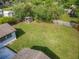 Expansive backyard features lush lawn and privacy fence, creating a serene outdoor oasis at 243 S Hull Ave, Deland, FL 32720