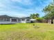 The spacious backyard includes a shed, well-maintained lawn, and new privacy fence at 243 S Hull Ave, Deland, FL 32720