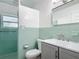 Charming bathroom with retro tiles, updated vanity and sink at 243 S Hull Ave, Deland, FL 32720