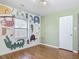 Bright bedroom with hardwood floors, fun animal mural, and a window at 243 S Hull Ave, Deland, FL 32720